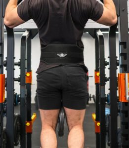 model-doing-chin-pull-ups-with-skates-sports-dipping-belt.jpg